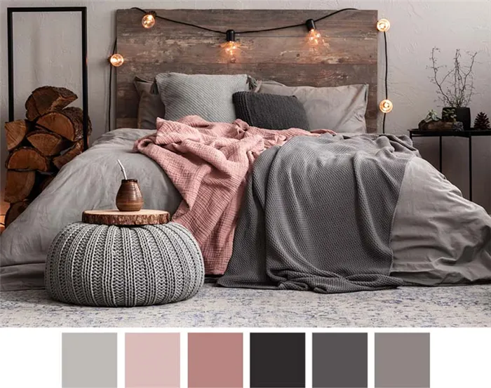 Серая уютная спальня с розовым покрывалом.